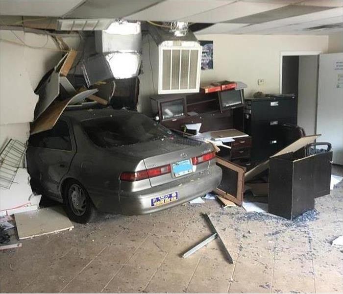 Office building with car in the middle of the room