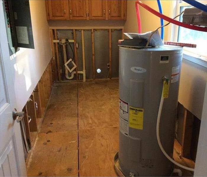 laundry room after damaged floors were removed