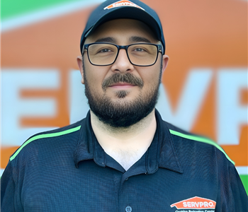 Young boy with hat, glasses and beard